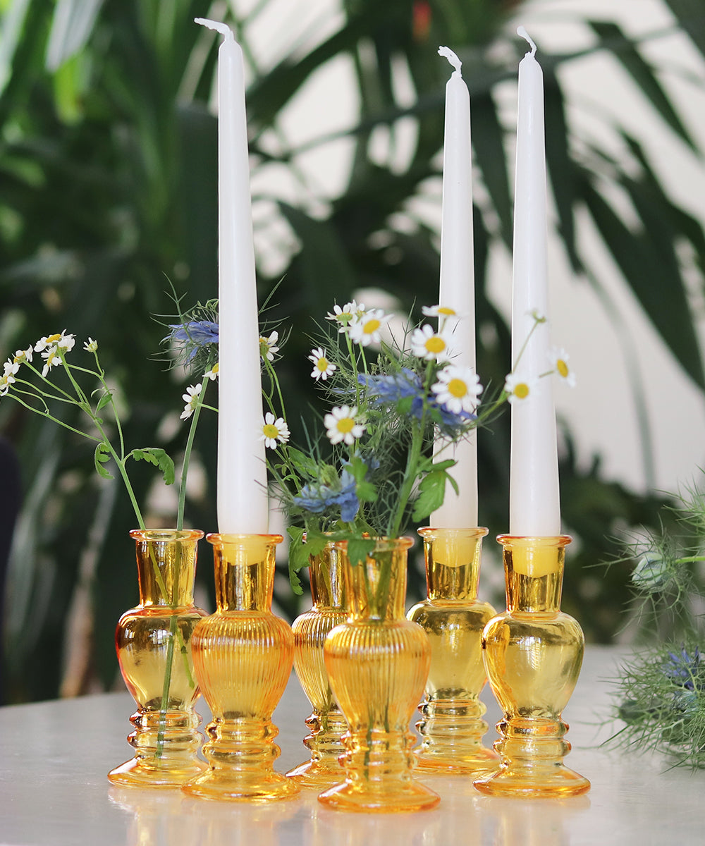 Gold Multi-Use Glass Vase and Candle Holder Set, chosen by master florist Lamber De Bie. This set of six exquisite gold-hued glass vases, available in two sizes, adds a touch of opulence to any setting